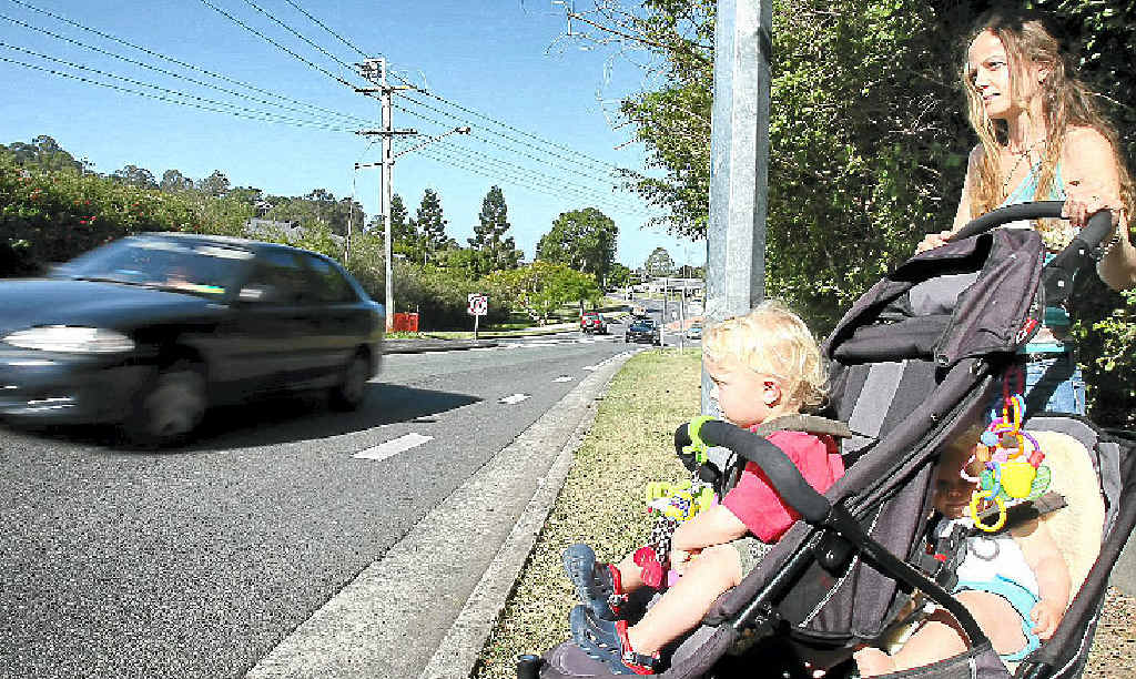 RISKY: Kate Panayi with her children Alexander, 2, and Phoebe, 1, face the crossing at Mudgeeraba. RISKY: Kate Panayi with her children Alexander, 2, and Phoebe, 1, face the crossing at Mudgeeraba.